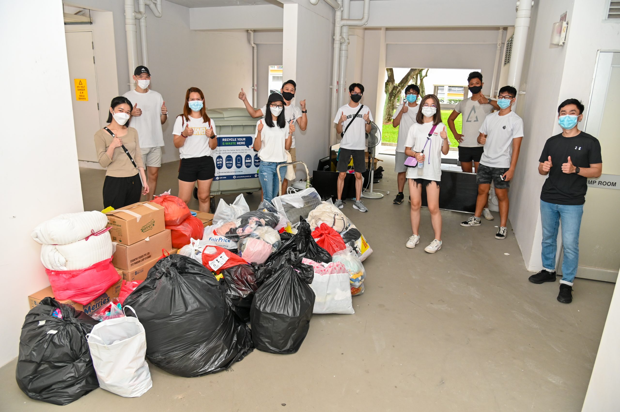 The youths’ ‘loot’ of recyclables — after a hard day of going door-to-door collecting e-waste & old clothes from seniors living in Teck Whye.