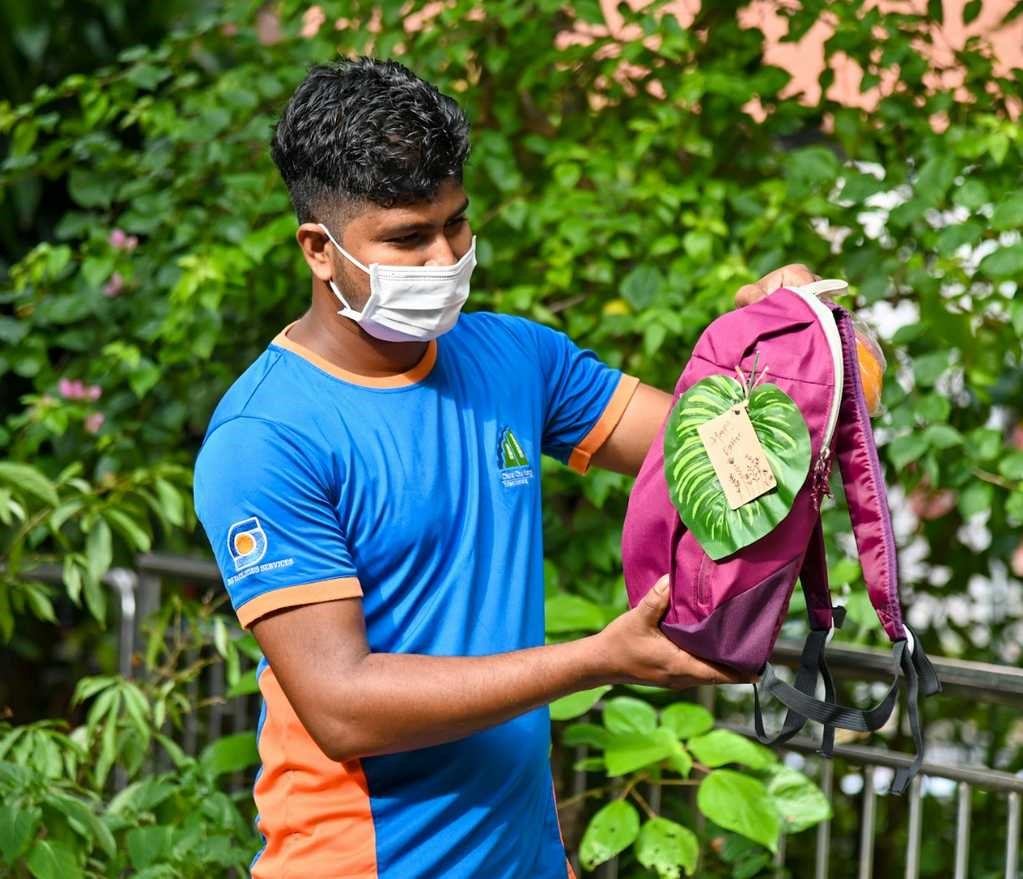 Cleaner Islam Saidul with the thoughtfully prepared care pack presented to him by some CCK estate residents.