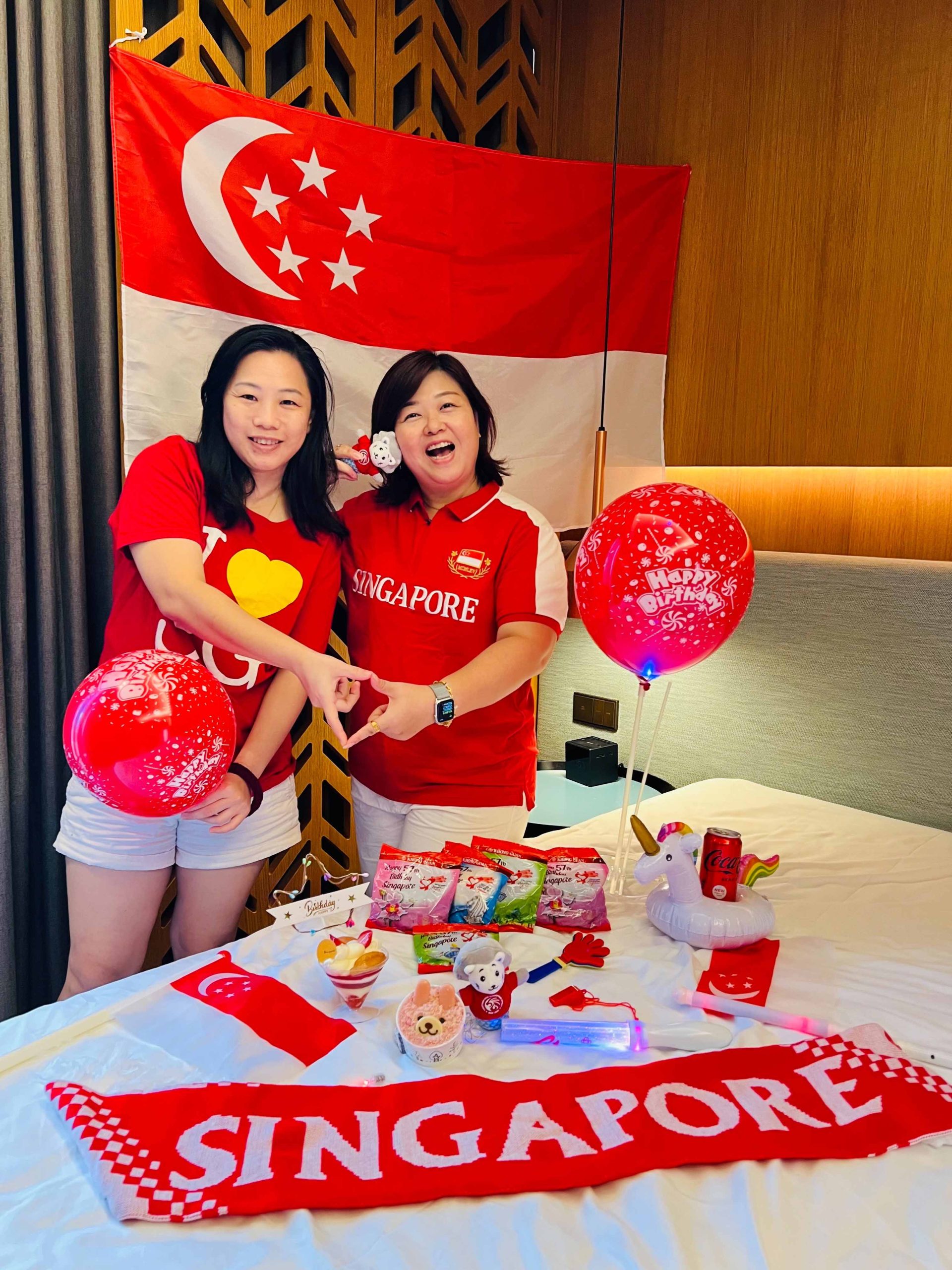 Vivian showcased her SG pride with her collection of items from National Day Parade (NDP) fun packs like a Singapore scarf and other collectables.